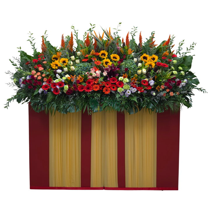 Prosperity Spire grand opening flower stand in bold red, orange and gold with bird of paradise, sunflowers and roses — The Green Corner Singapore
